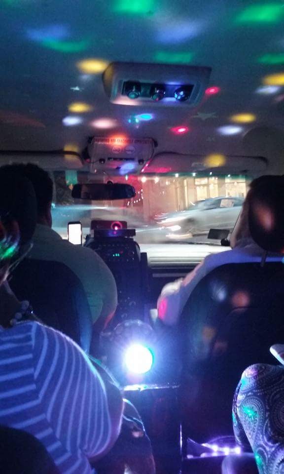The inside of the Uber with the strobe lights & karaoke.